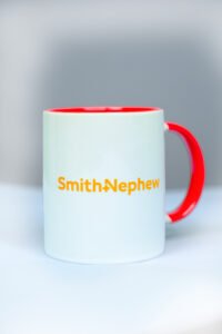 Premium ceramic mug with vibrant inner color and company branding – ideal for corporate gifting or employee use.